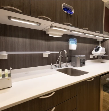 Modern dental sterilization station with sleek cabinetry and equipment